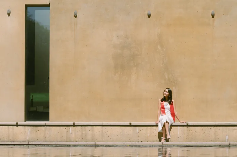Seattle University senior graduation portrait by Chapel of St. Ignatius reflecting pool