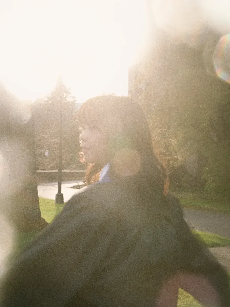 UW Foster School of Business terrace graduation portrait in natural light