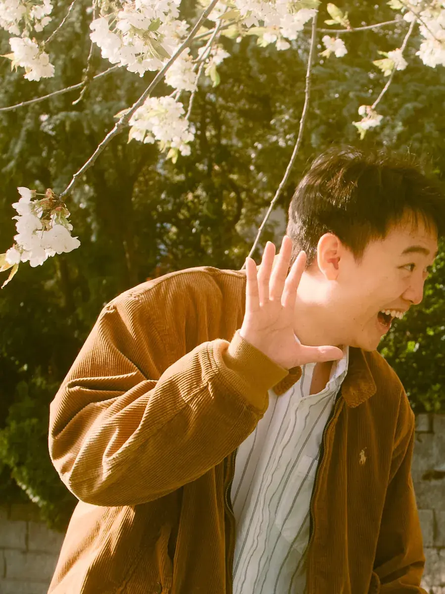 Playful laugh in warm natural sunlight