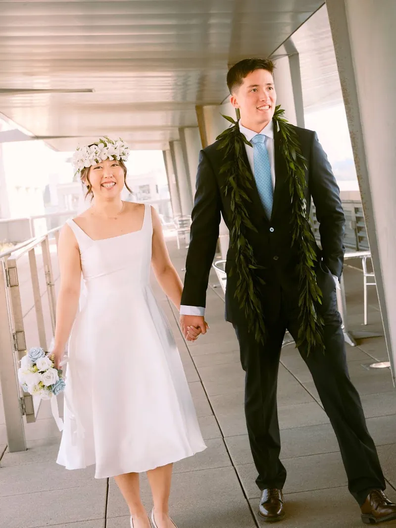 Newlyweds taking a relaxed portrait walk on a Seattle courthouse terrace