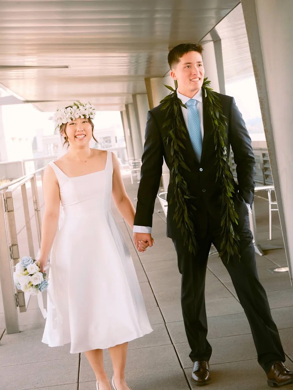 Seattle courthouse elopement couple strolling on the terrace with city skyline views