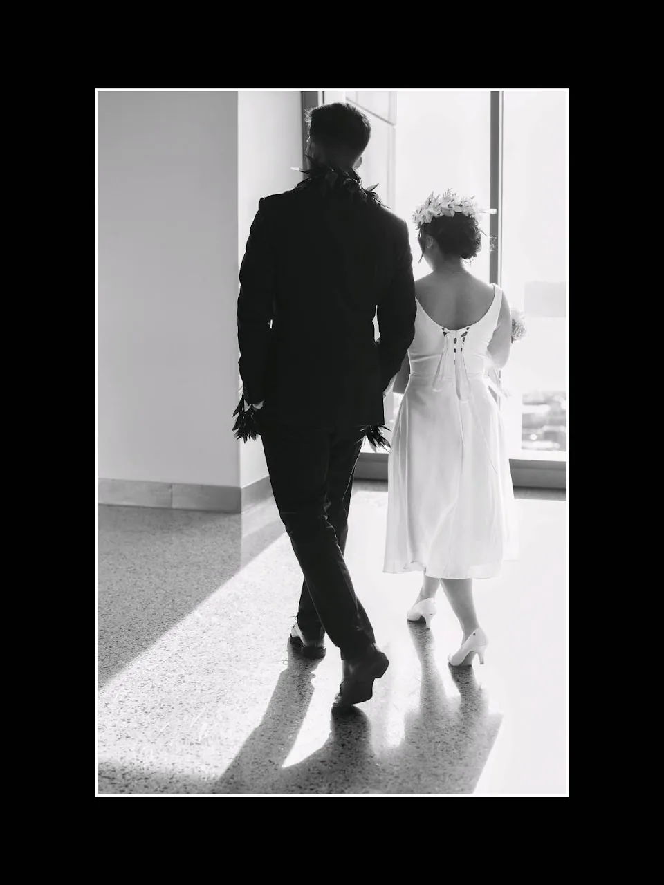 Cinematic backlit hallway walk after Seattle courthouse wedding ceremony
