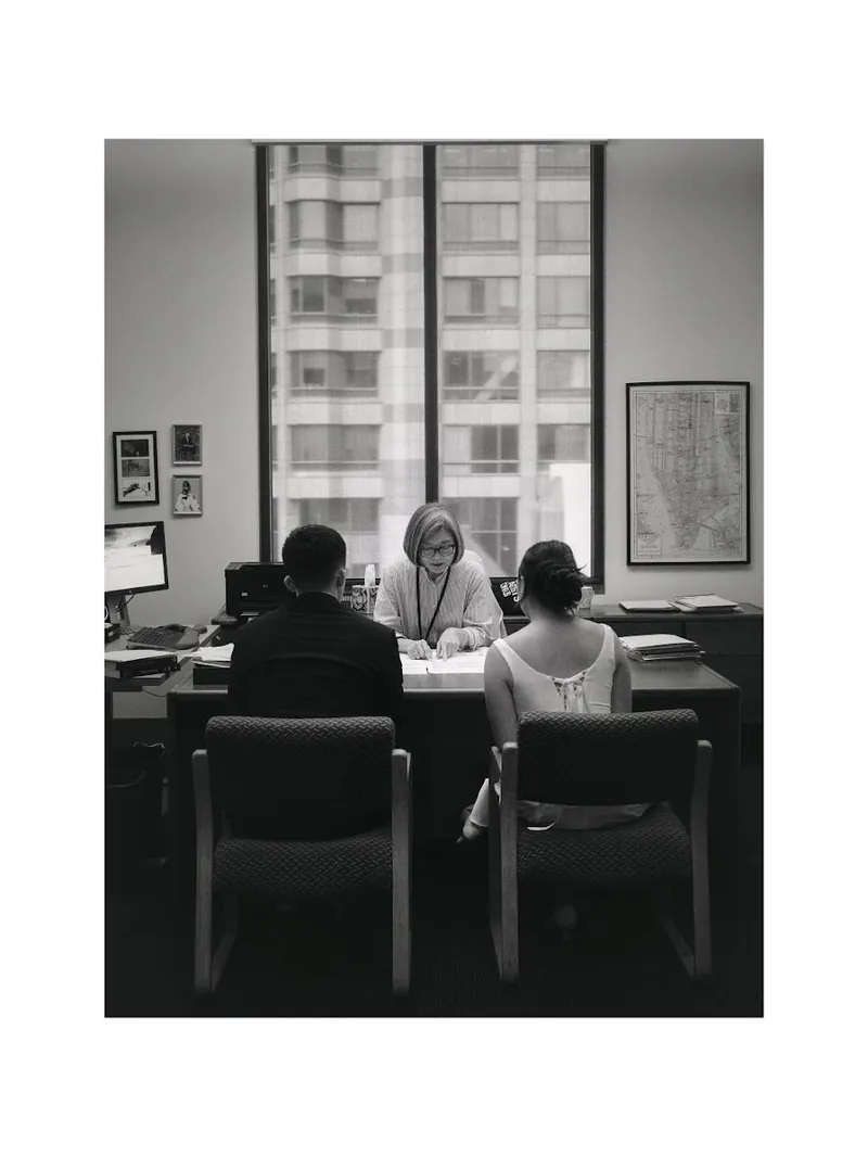 Newlyweds signing their marriage license at a Seattle courthouse