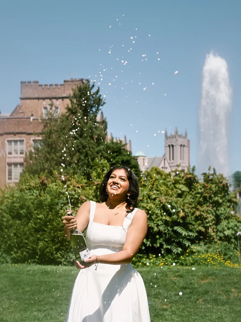 UW senior graduation portrait at Drumheller Fountain overlooking Rainier Vista