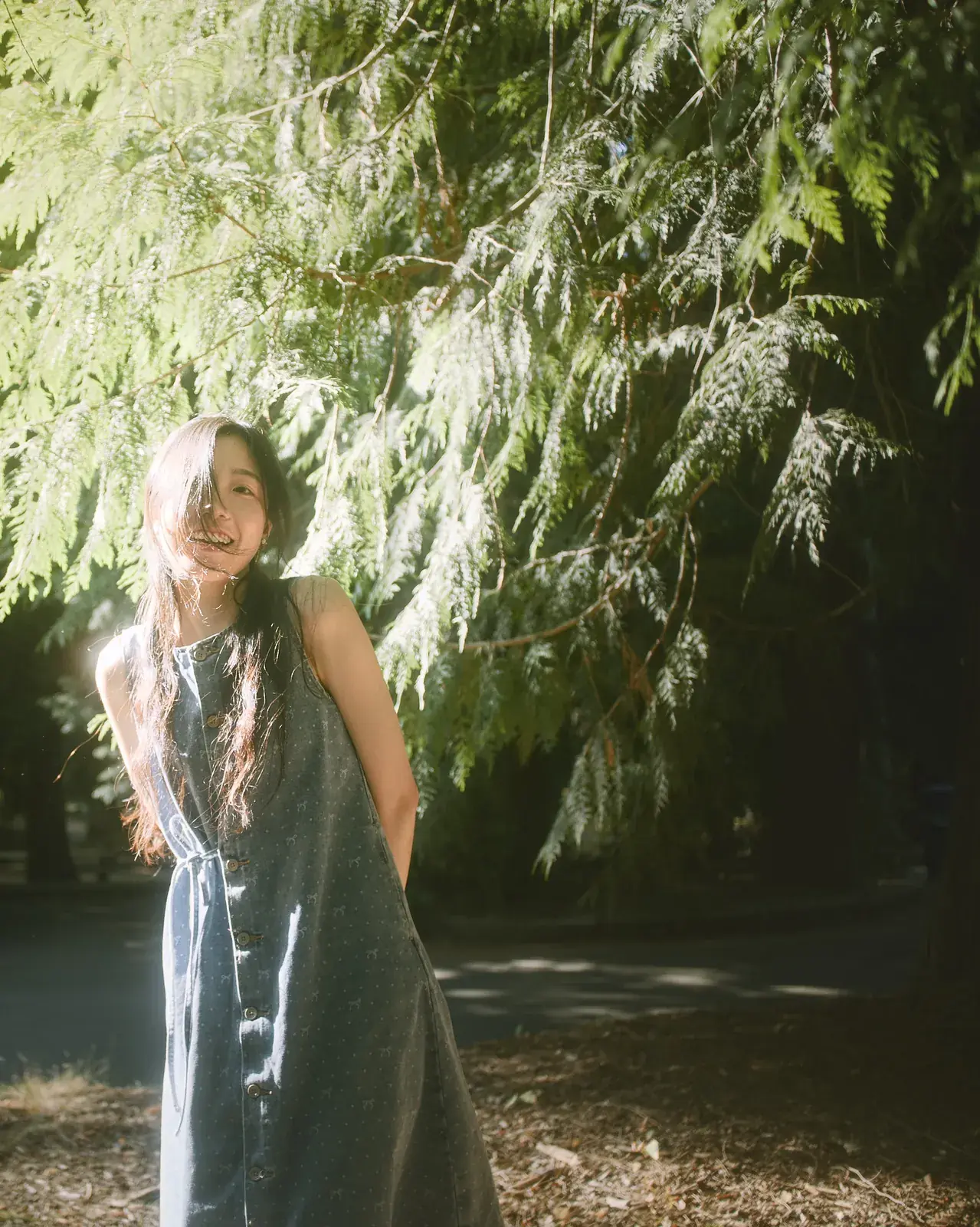 Serene natural light portrait amidst willow trees and botanical gardens on the Eastside